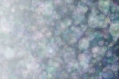 Harmonik renklere sahip güzel soyut bir arka plan. Yumuşak bokeh ışık noktaları.