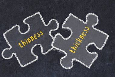 İnce ve kalın kelimelerle iki bulmacanın tebeşir çizimi. Sorunları çözme kavramı