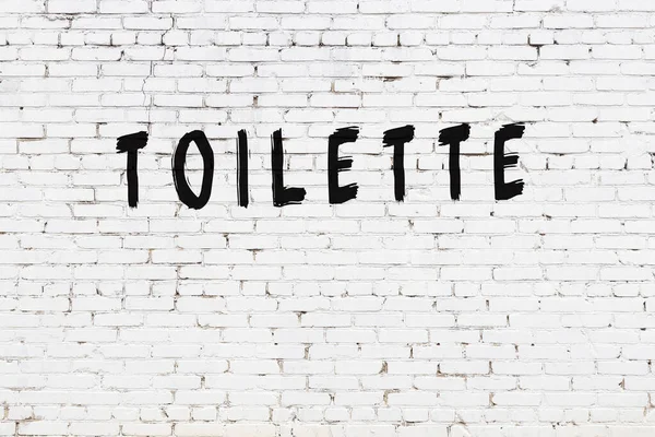 Inscription Toilette Written Black Paint White Brick Wall — Stock Photo, Image