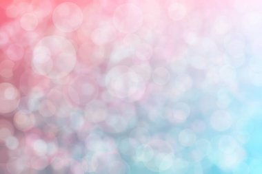 Pembe ve mavi soyutlanmış arka plan daire şeklindeki bokeh noktalarıyla