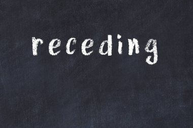 Üzerinde el yazısı olan bir kolej tahtası.