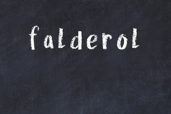黒の机の上に手書きの碑文Falderolをチョーク — ストック写真