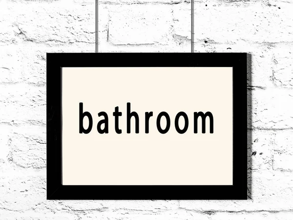 Black Wooden Frame Inscription Bathroom Hanging White Brick Wall — Stock Photo, Image
