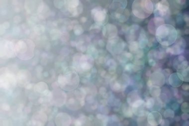 Daire şeklinde bokeh noktaları olan renkli bir arkaplan. Soyutlama