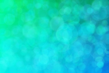 Yeşil ve mavi soyut arkaplan, yeşilden maviye ve daire şeklindeki beneklere geçiş.