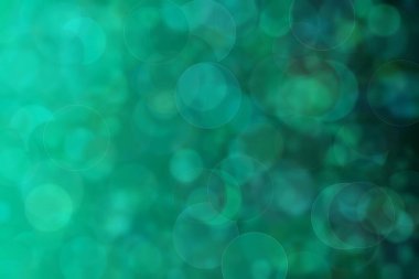 Yeşil ve mavi renkli ve daire şeklindeki desenlere sahip soyut ve güzel harmonik arkaplan.