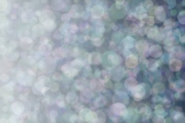 Bokeh ile soyut bir arkaplan. Yumuşak ışık odaklı noktalar.