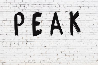 Yazıt zirvesi beyaz tuğla duvara siyah boya ile yazılmış..