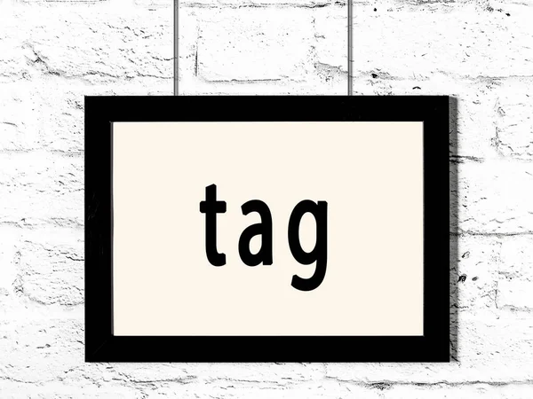 Black Wooden Frame Inscription Tag Hanging White Brick Wall — Stock Photo, Image