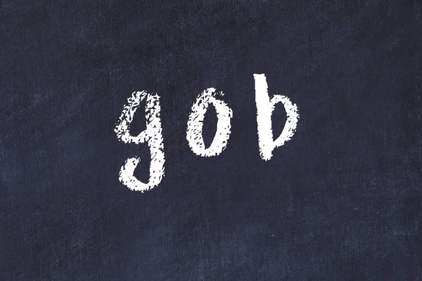 Tebeşir elle yazılmış yazı masasında.