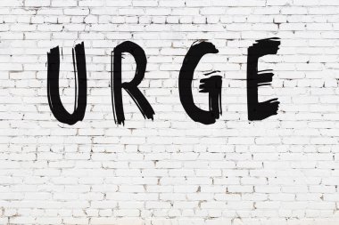 Yazı dürtüsü, beyaz duvara siyah boya ile yazılmış..