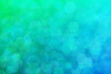 Yeşilden maviye ve altıgen şekilli beneklere geçiş yapan yeşil ve mavi soyut arkaplan.
