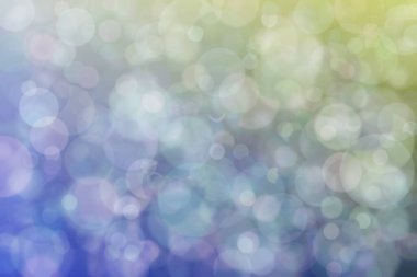 Daire şeklinde bokeh noktaları olan renkli bir arkaplan. Soyutlama