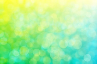 Pozitif parlak soyut arkaplan. Mavi 'den sarı' ya geçişler ve Bokeh 'le daire şeklinde desenler..