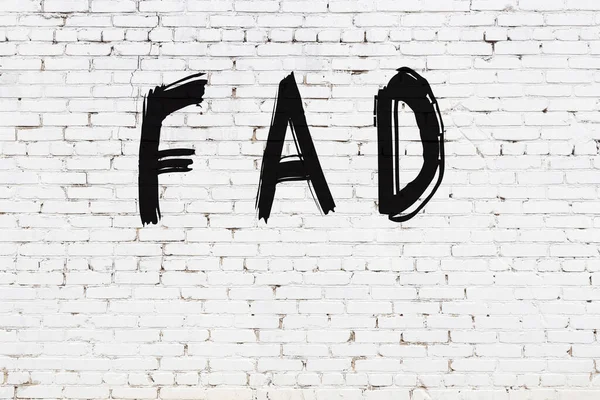 Inscription Fad Written Black Paint White Brick Wall — Stock Photo, Image