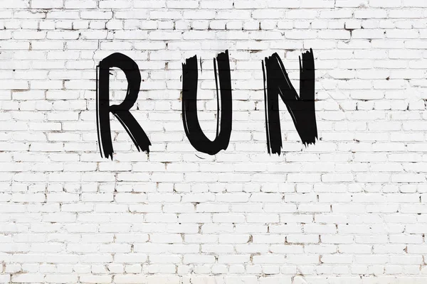 Inscription Run Written Black Paint White Brick Wall — Stock Photo, Image