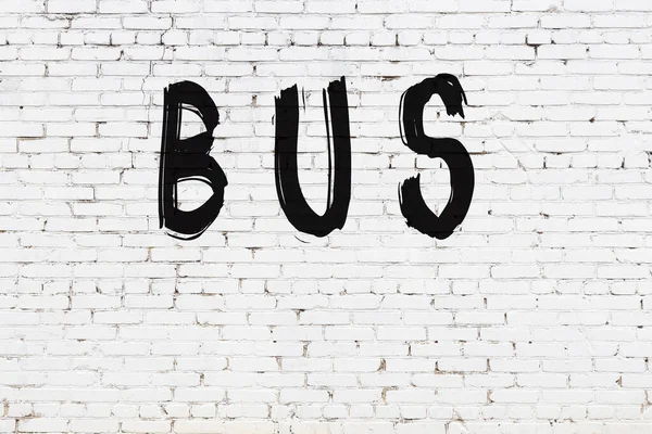 Inscription Bus Written Black Paint White Brick Wall — Stock Photo, Image