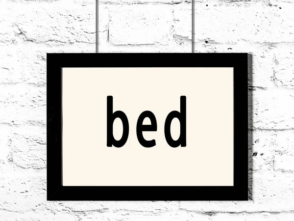 Black Wooden Frame Inscription Bed Hanging White Brick Wall — Stock Photo, Image