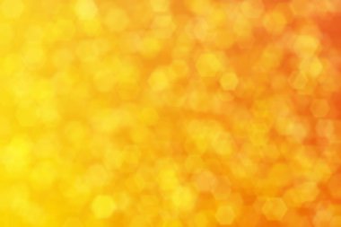 turuncu ve sarı soyutlanmış arkaplan, altıgen şekilli bokeh lekeli.