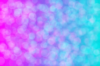 Pembe ve açık mavi soyut çözünmüş arkaplan daire şeklindeki bokeh noktalarıyla