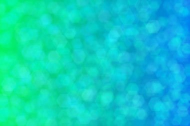 Altıgen şekilli bokeh noktalı yeşil ve mavi soyut odaklanmış arkaplan