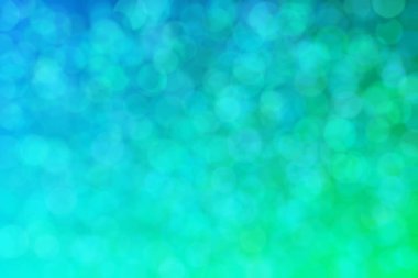 Yeşil ve mavi soyut arkaplan, yeşilden maviye ve daire şeklindeki beneklere geçiş.