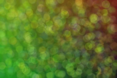 Çember şekilli bokeh benekli yeşil ve koyu soyut arkaplan