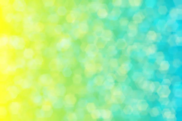 blue and yellow abstract defocused background with hexagon shape bokeh spots