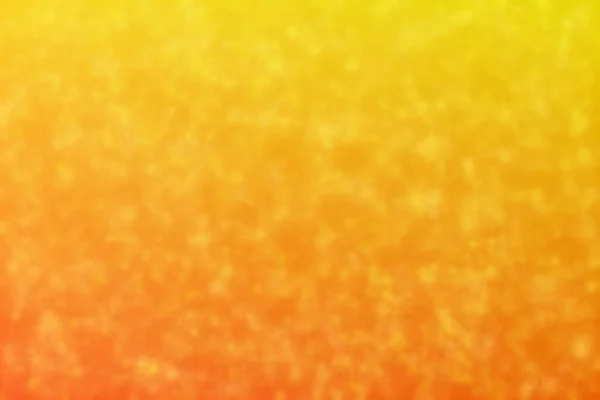 オレンジ色と黄色の抽象的な背景と星形のボケのスポット — ストック写真
