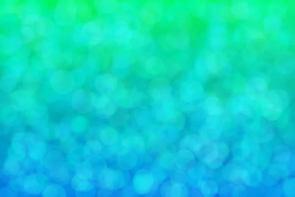 Green and blue abstract background with color transitions from green to blue and circle shaped spots.