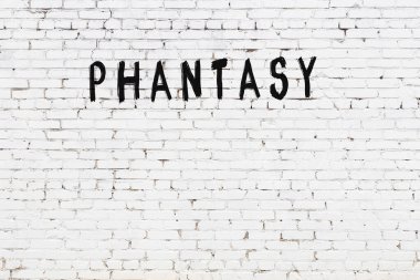 Yazılı beyaz tuğla duvar. Siyah boyalı el yazısı.