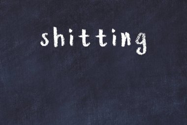 College chalkboard  with with handwritten inscription shitting on it