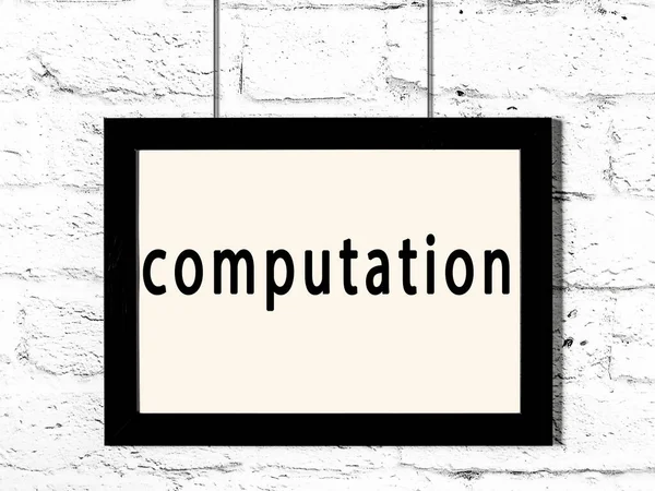 Black Wooden Frame Inscription Computation Hanging White Brick Wall — Stock Photo, Image