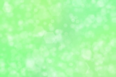 açık yeşil soyut odaklanmış arkaplan altıgen şekilli bokeh benekleri ile