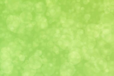 Çember şekilli bokeh benekli yeşil soyut odaklanmış arkaplan