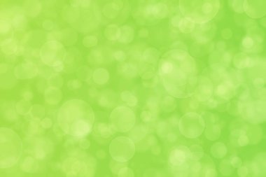 Çember şekilli bokeh benekli yeşil soyut odaklanmış arkaplan