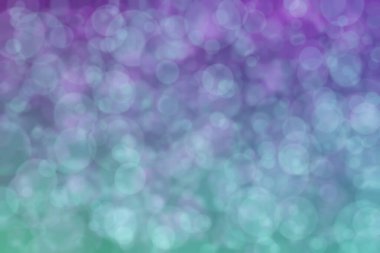 Çember şekilli bokeh benekli mor ve yeşil soyut odaklı arkaplan