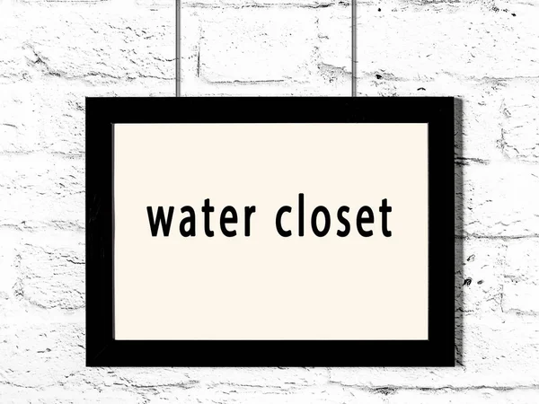 Black Wooden Frame Inscription Water Closet Hanging White Brick Wall — Stock Photo, Image