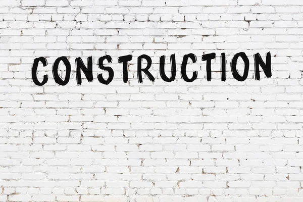 White Brick Wall Inscription Construction Handwritten Black Paint — Stock Photo, Image