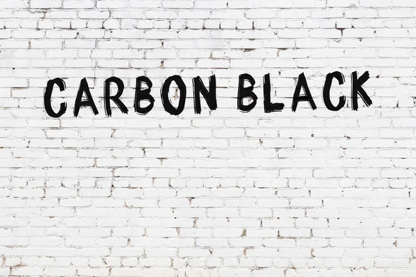 Yazılı Beyaz Tuğla Duvar Karbon Siyah Yazısı Siyah Boya — Stok fotoğraf