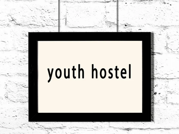 Black Wooden Frame Inscription Youth Hostel Hanging White Brick Wall — Stock Photo, Image
