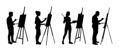 Stüdyoda resim yapan insanların siluetleri.