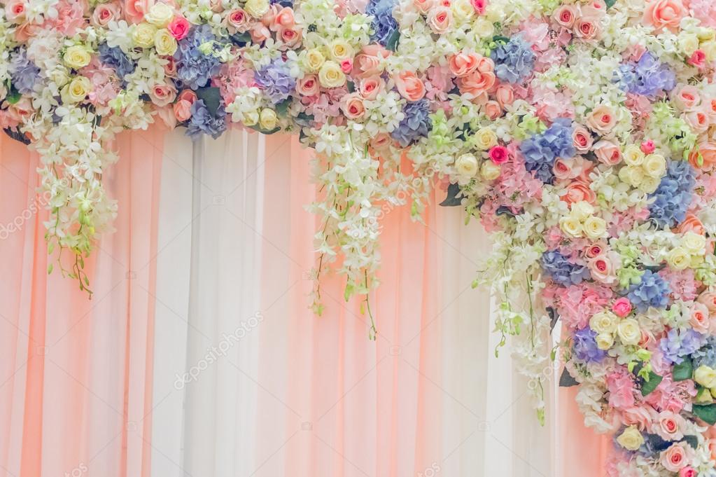 Beautiful flowers over fabric backdrop for wedding ceremony Stock Photo