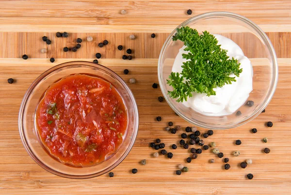 Sauces and pepper on a wooden board — Stock Photo, Image