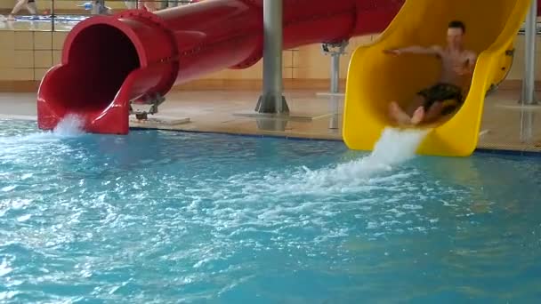 Teen Enjoying Ride On Water Slide — Stock Video