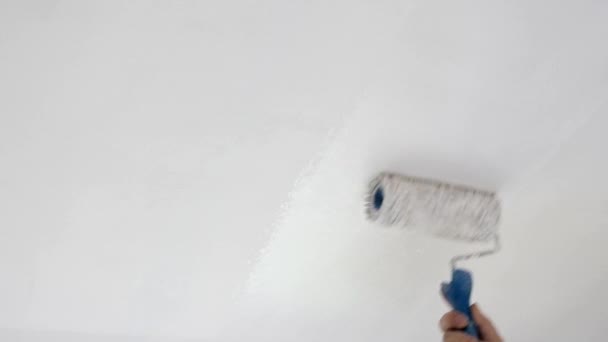 Man Painting Ceiling With Roller Slow Motion 1