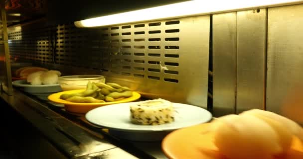 Sushi On Conveyor Belt In Japanese Restaurant — Stock Video