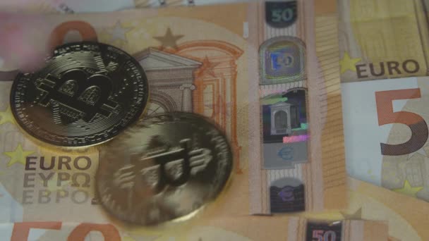Euro bills and golden bitcoins — Stock Video