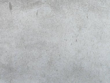 İnce bir sese ve soluk endüstriyel estetiğe sahip yaşlanmış ve yıpranmış beton duvar. Eski gri beton duvar, hasarlı paslı çatlak ve siyah doku tasarımı, klasik boş yüzey tozlu arka plan, sıkıntılı grunge beton.