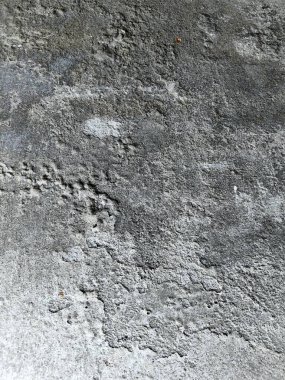 Soyut Grunge Çimento Duvarı Dokusunun Doğal Beton Yüzeyi. Yüksek çözünürlüklü soyut grunge beton duvar dokusu. Doğal beton bir yüzey, yıpranmış lekeler, çatlaklar ve ince detaylar. Arka planlar için ideal